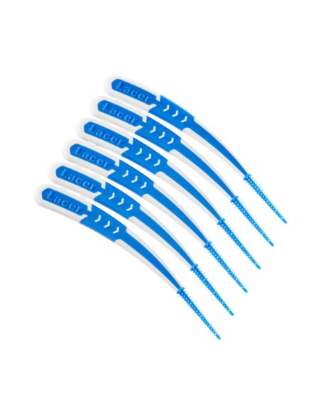 Primer plano de los palillos de higiene dental con filamentos de goma azules y mangos ergonómicos blancos.