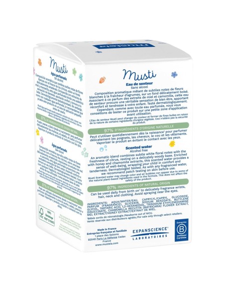 Reverso de la caja de la colonia Mustela Musti detallando sus ingredientes de origen natural e instrucciones en varios idiomas.