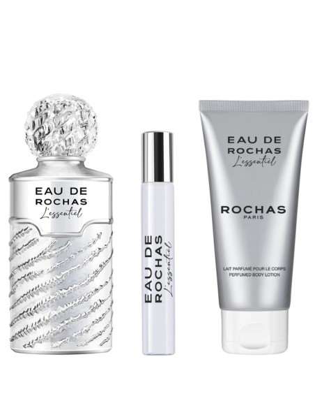 Frasco Eau de Rochas LEssentiel junto al formato de viaje y la loción corporal perfumada