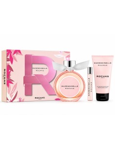 Caja rosa de Mademoiselle Rochas junto al frasco de perfume, la miniatura y la loción
