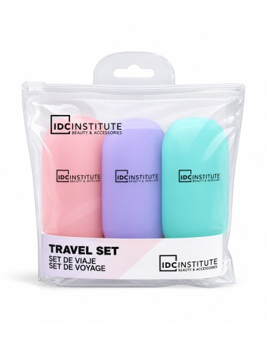 Set de viaje IDC Institute con neceser transparente y tres botes en rosa, lila y turquesa