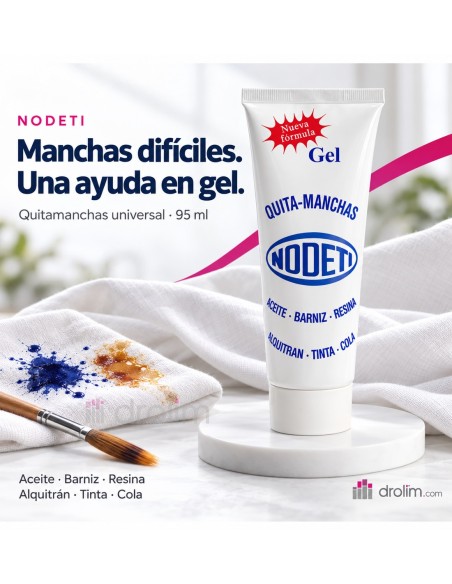 Nodeti quitamanchas en gel de 95 ml junto a un tejido blanco con manchas y un pincel